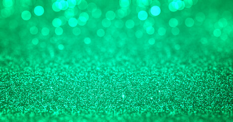 Sparkling turquoise cyan green glitter background with bokeh. Closeup view, dof. Pattern with...