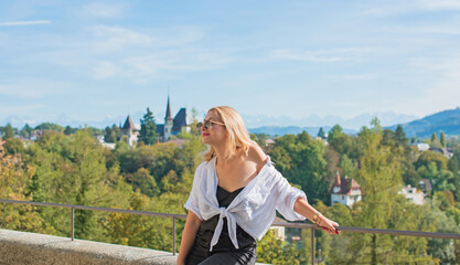 Vacation in Switzerland - Bern. Concept of tourism and holidays. Woman in city streets, urban scene