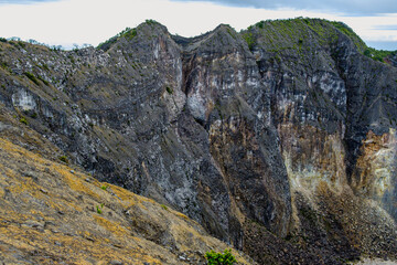 On the verge of a peak, on the edge of a precipice, sky and land merge in overwhelming beauty 