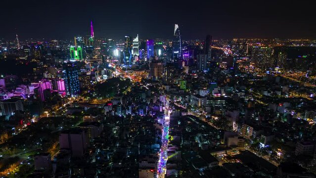 Night timelapse of downtown Ho Chi Minh City and the illuminated Bui Vien party street, Vietnam.
