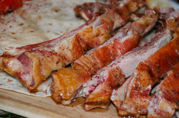 Slices of pork cut and baked lie on pita bread, ready dish