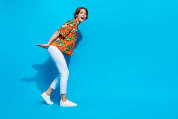 Full length profile photo of astonished person arms hold carry empty space weight isolated on blue color background