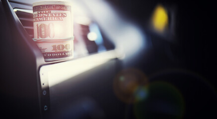 Concept background. dollars with a car key lie in inside cars. financial concept