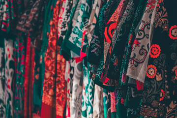 Traditional uzbek multicolored robes (caftan) in souvenir shop. Tashkent, Uzbekistan