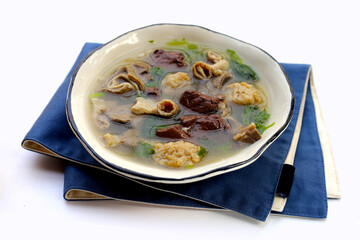 Bowl of pork blood soup on white background.
