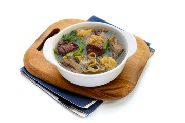 Bowl of pork blood soup on white background.