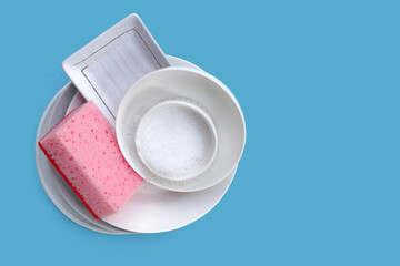 Bowl and plate with cleaning spong. Washing dishes concept