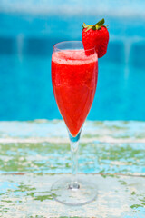 Champagne glasses with strawberry. Rossini cocktail. Summer pool party
