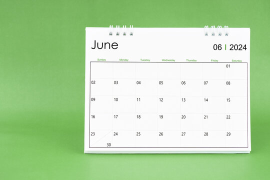 June 2024 desk calendar isolated in green background.