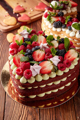 Heart Shaped Red Velvet Cake with Fresh Berries and Cream - 716582912