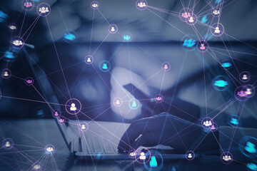Close up of hands using laptop computer and phone with connected digital people team icons on blurry purple background. Digital network, online community and social media concept. Double exposure.