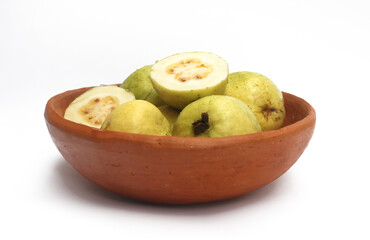Tropical fruit from Latin America in a clay bowl. Guava from Brazil.