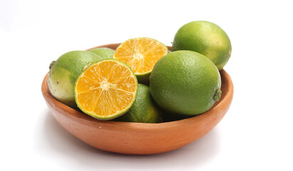 Yellow lemon in a clay bowl. Lemon from Brazil.