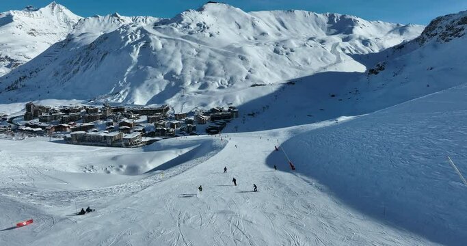 Winter drone shot of ski pistes and slopes covered with fresh powder snow in Tignes in Valdisere France