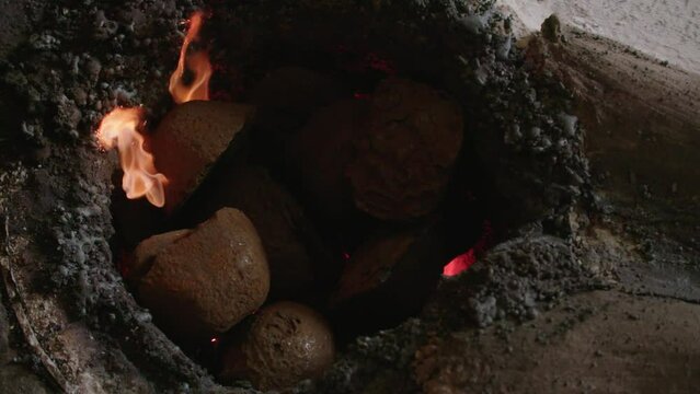 Close up of Flaming Furnace Rod stiring