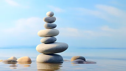 Zelfklevend Fotobehang stack of stones on the beach - balance pile © Lisanne