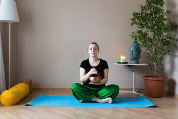 Middle aged woman doing yoga indoors