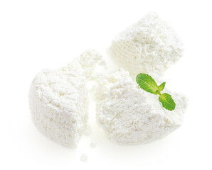 Cottage cheese isolated on white background closeup. Fresh grainy cottage cheese or feta with mint for package design