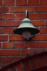 old street lamp on the background of a brick wall