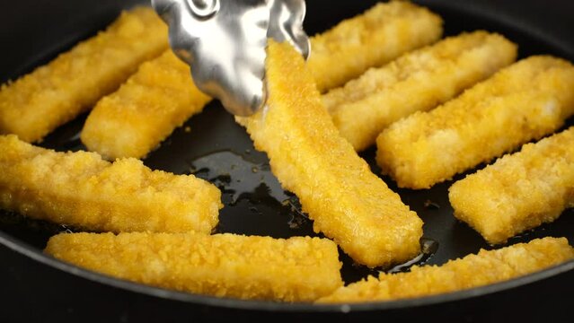 Cooking Fish fingers in frying pan