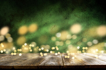 Happy St. Patricks Day background. Abstract green background with empty wooden table and glitter...