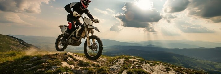 Motocross rider on the high mountain. Extreme sport concept. Motocross. Enduro. Extreme sport concept. - obrazy, fototapety, plakaty