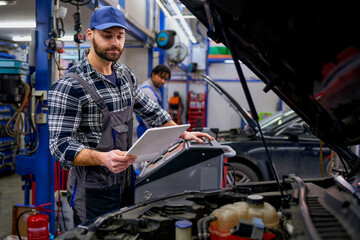 In the workshop, a mechanic utilizes a tablet for diagnostics and parts availability, seamlessly blending traditional expertise with modern technology.
