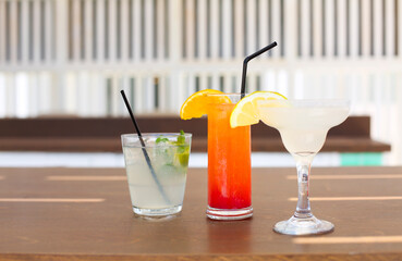 Cocktail glasses on wooden background