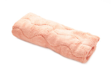 Pink soft towel isolated on white background.