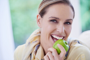 Portrait, eating or happy woman with apple for healthy or balanced diet with nutrition or vitamins....