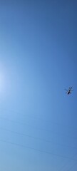 Helicopter on clear sky - scrolling image