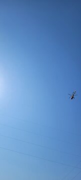 Helicopter on clear sky - scrolling image