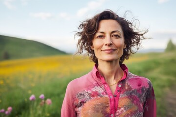 Portrait of a tender woman in her 40s sporting a breathable mesh jersey against a bright spring meadow. AI Generation
