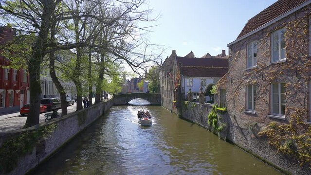 Boat Riding On Water Canal In Bruges, Belgium