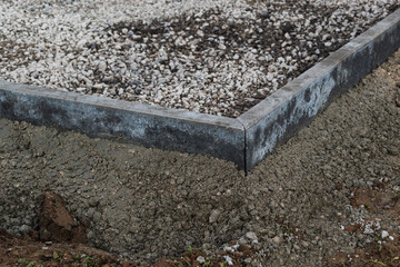 Concrete garden borders with cement to demarcate paths, parkings, sidewalks and flowerbeds