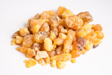 Frankincense or olibanum aromatic resin isolated on white background used in incense and perfumes.