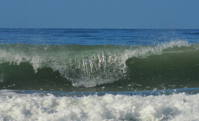 a beautiful wave on a beach in the Caribbean Sea