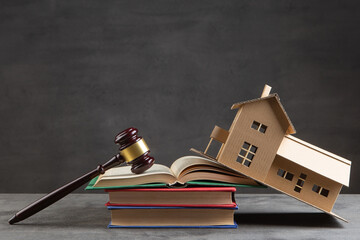 House model, gavel and books on the desk, Real property law concept, real estate auction - 716680589