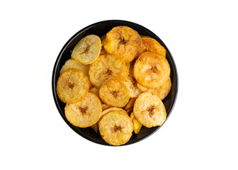 fried banana chips on black bowl isolated on white background