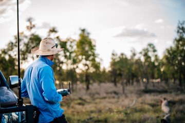 Man with remote control looking into distance