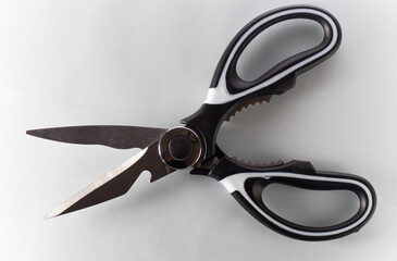 Single kitchen scissors on a white background
