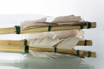 Fletching on homemade arrows on a white background