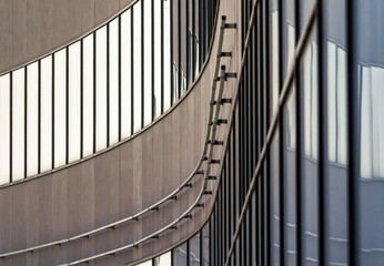 Obraz premium fragment of high gray concrete building with empty windows