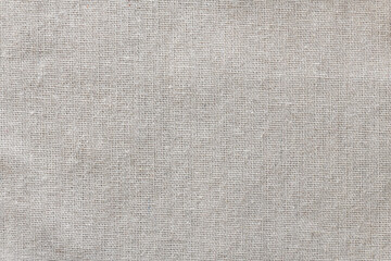 Light linen fabric as a background or texture.