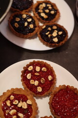 Artisanal Raspberry and Blackberry Tarts with Hazelnut Topping