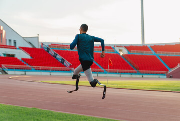 Asian para-athlete runner prosthetic leg on the track alone outside on a stadium track Paralympic running concept.
