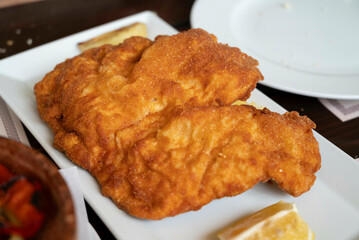 Chicken schnitzel, a thin slice of meat, which usually thinned by pounding with a meat tenderizer....