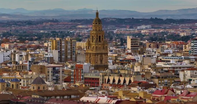 Aerial view of centre of european city Murcia, Spain. Establishing aerial shot of center of city. Spanish tourist city not far from the sea. Sunset