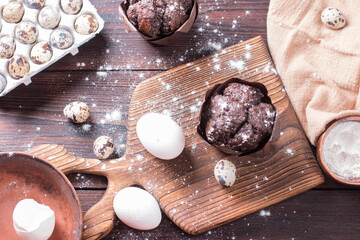 Making muffin cupcake in the kitchen. Chocolate pastries on a plate
