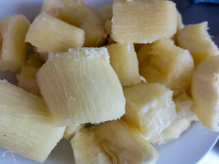 Selective photo of boiled cassava on a white plate. Replacement carbohydrates of rice.
